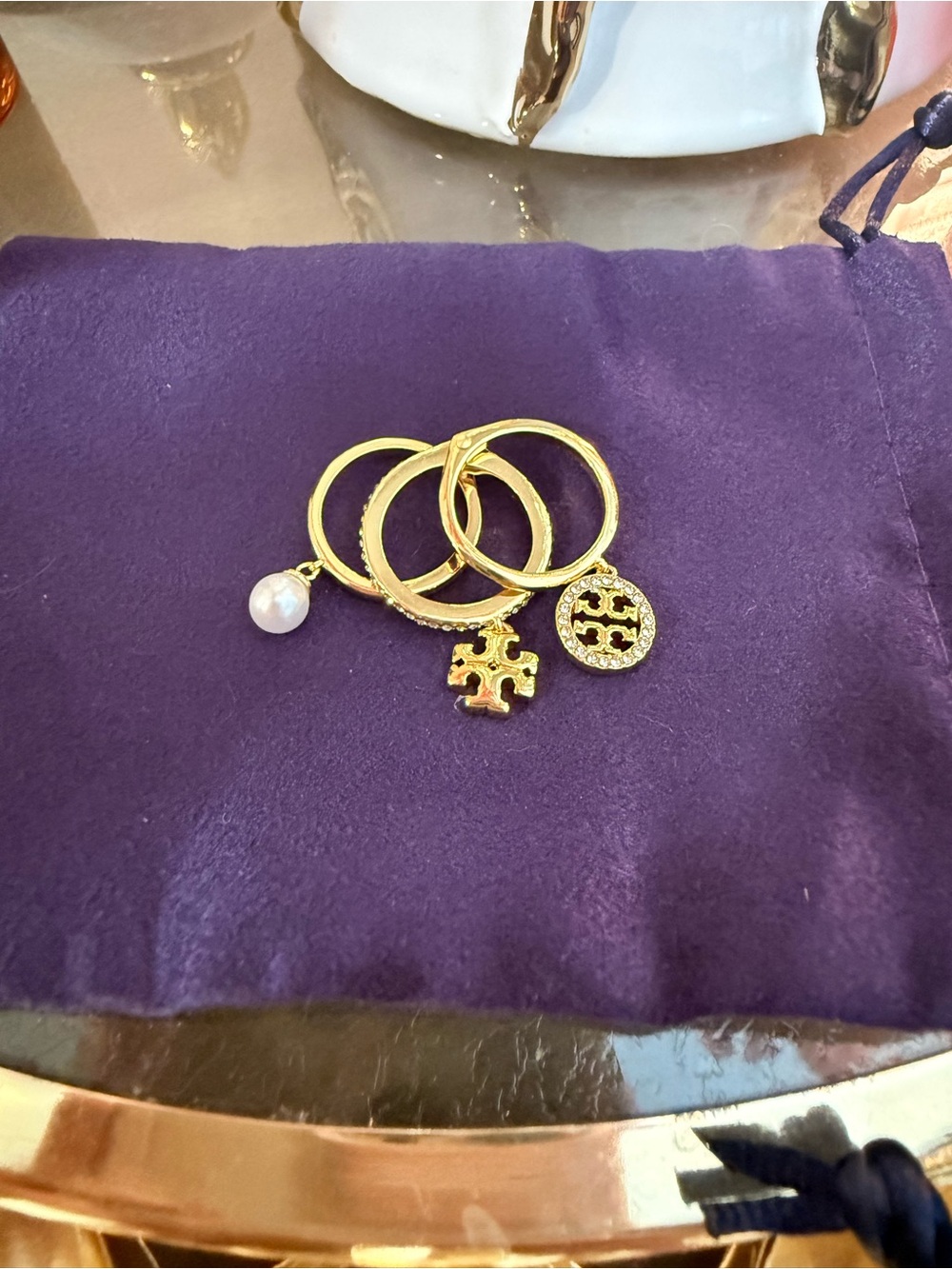 Tory Burch Gold Tone Stackable Ring Set with Pearl and Logo Charms - Size 6